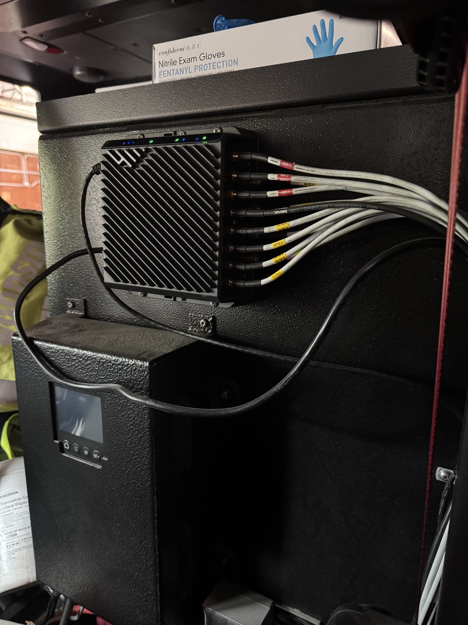 Cradlepoint router with labeled antenna leads in a fire apparatus cab